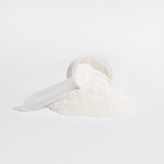 Scoop and mound of vanilla Grass-Fed Collagen Creamer powder